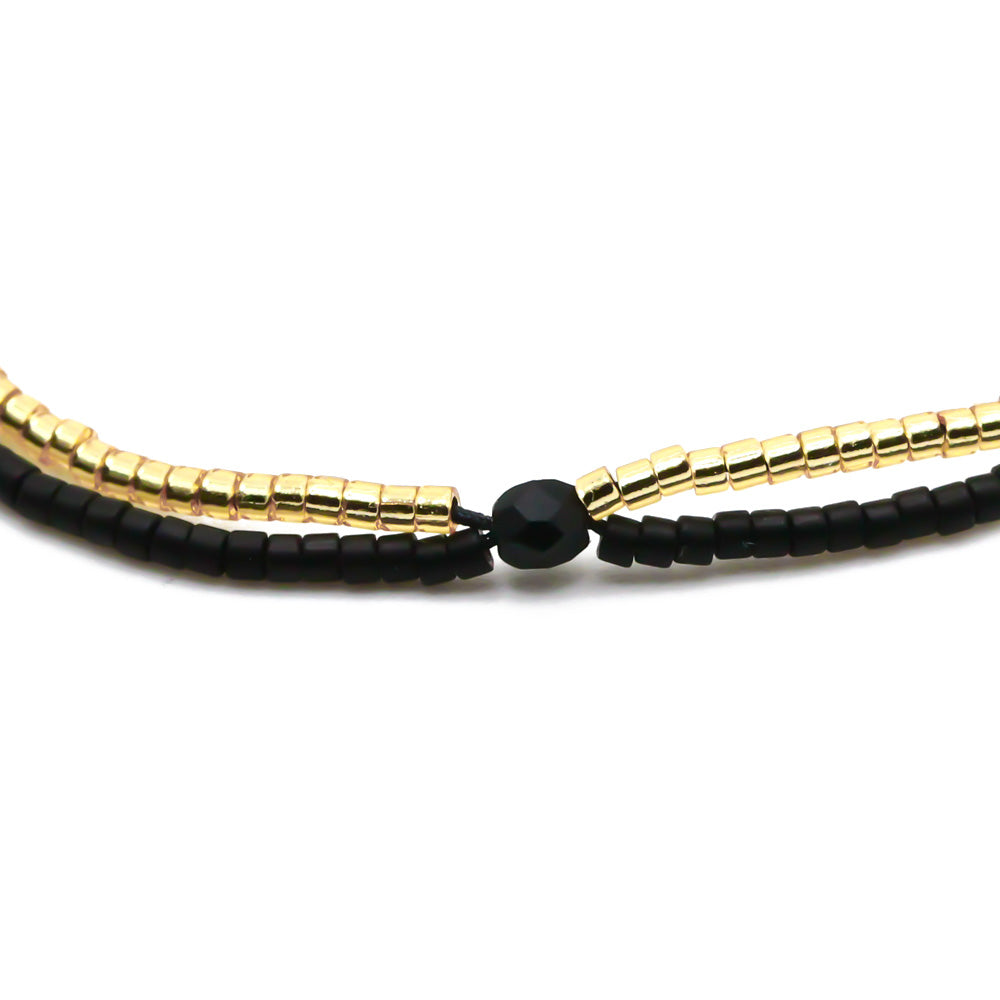 perlenarmband schwarz gold