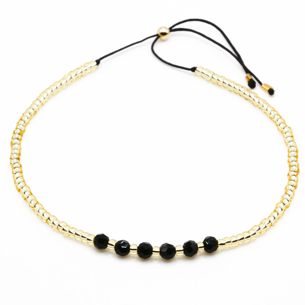 Perlenarmband gold schwarz mit Kristallen