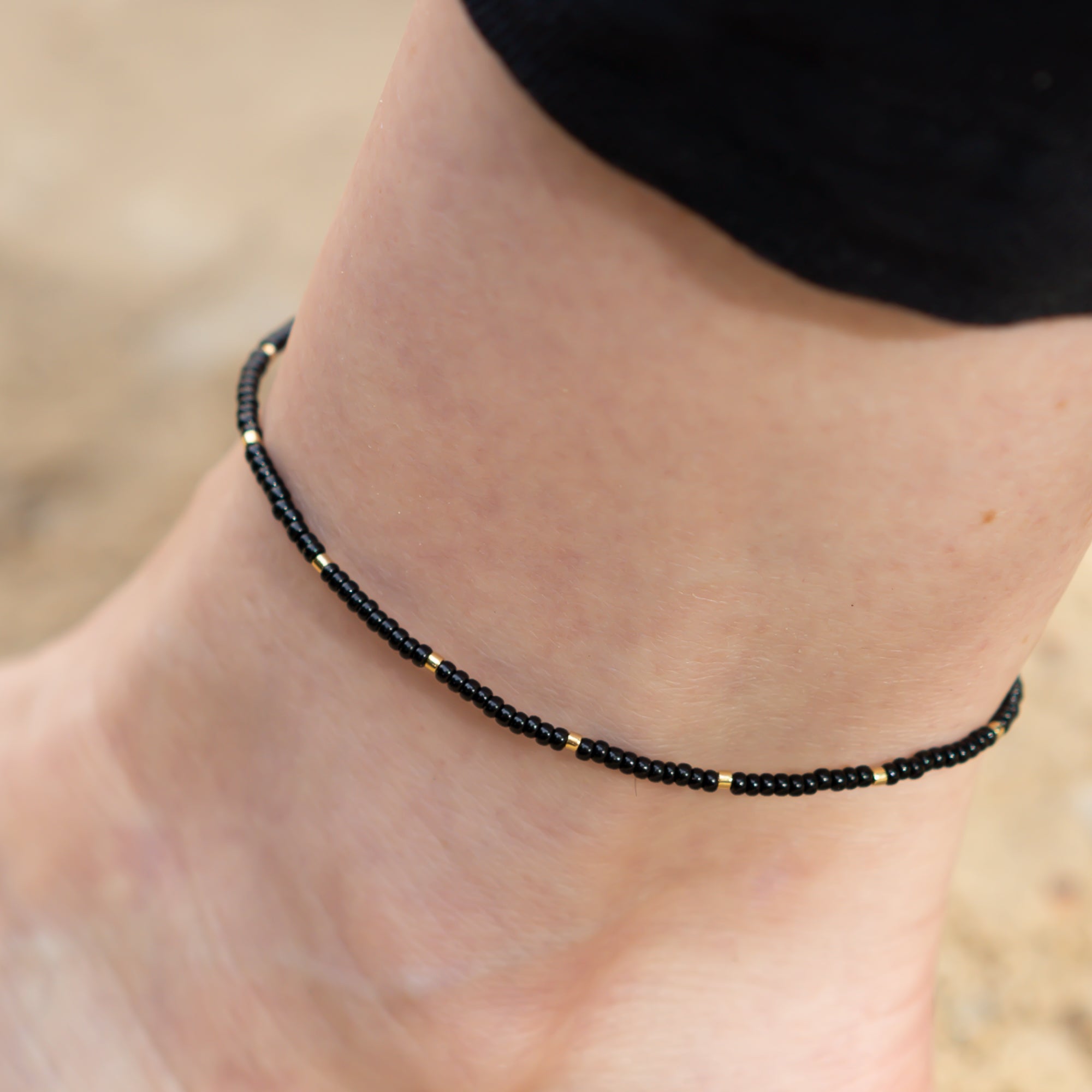 damen Perlenfußkettchen schwarz gold