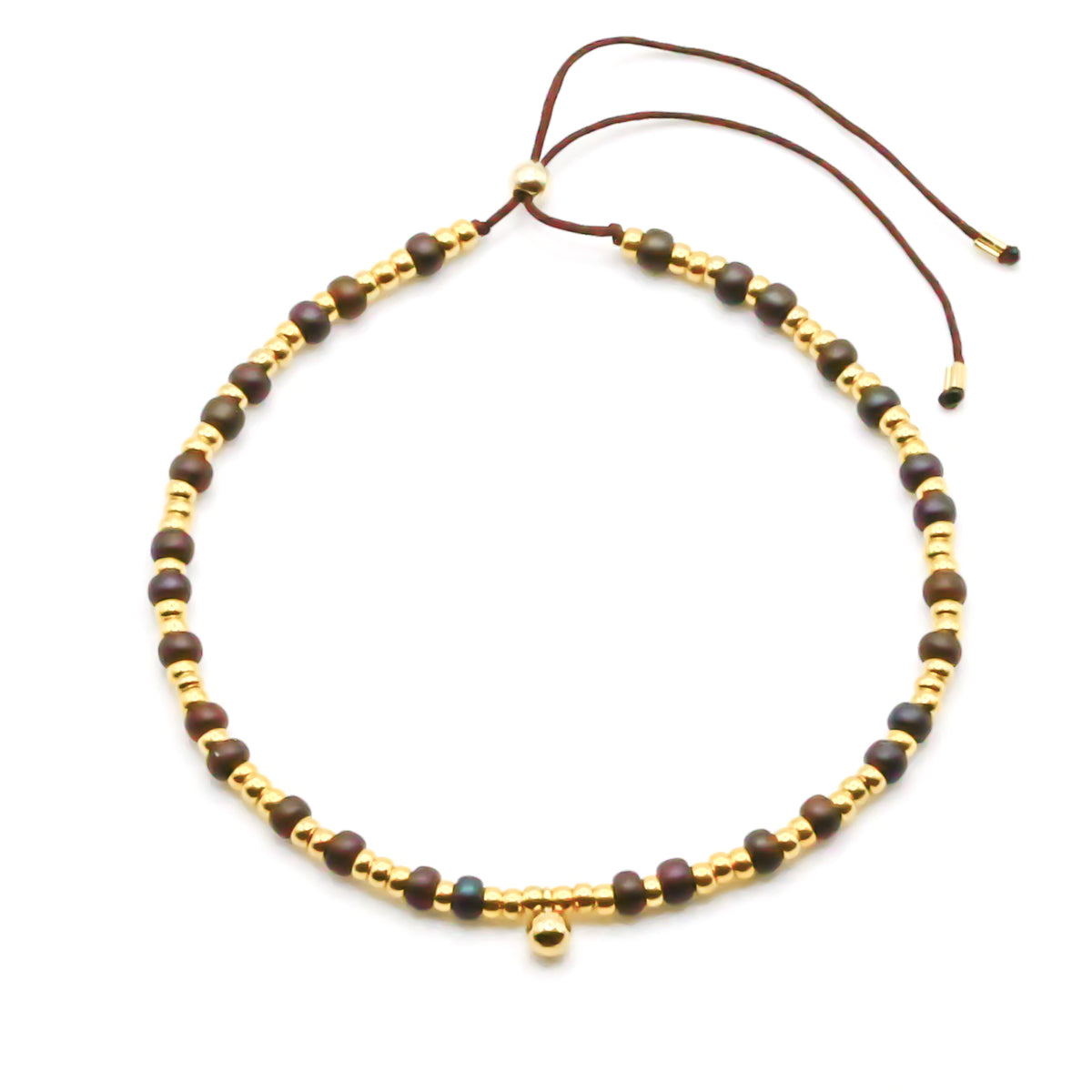 Damen perlenarmband aus goldperlen und mit einem goldkugel anhänger