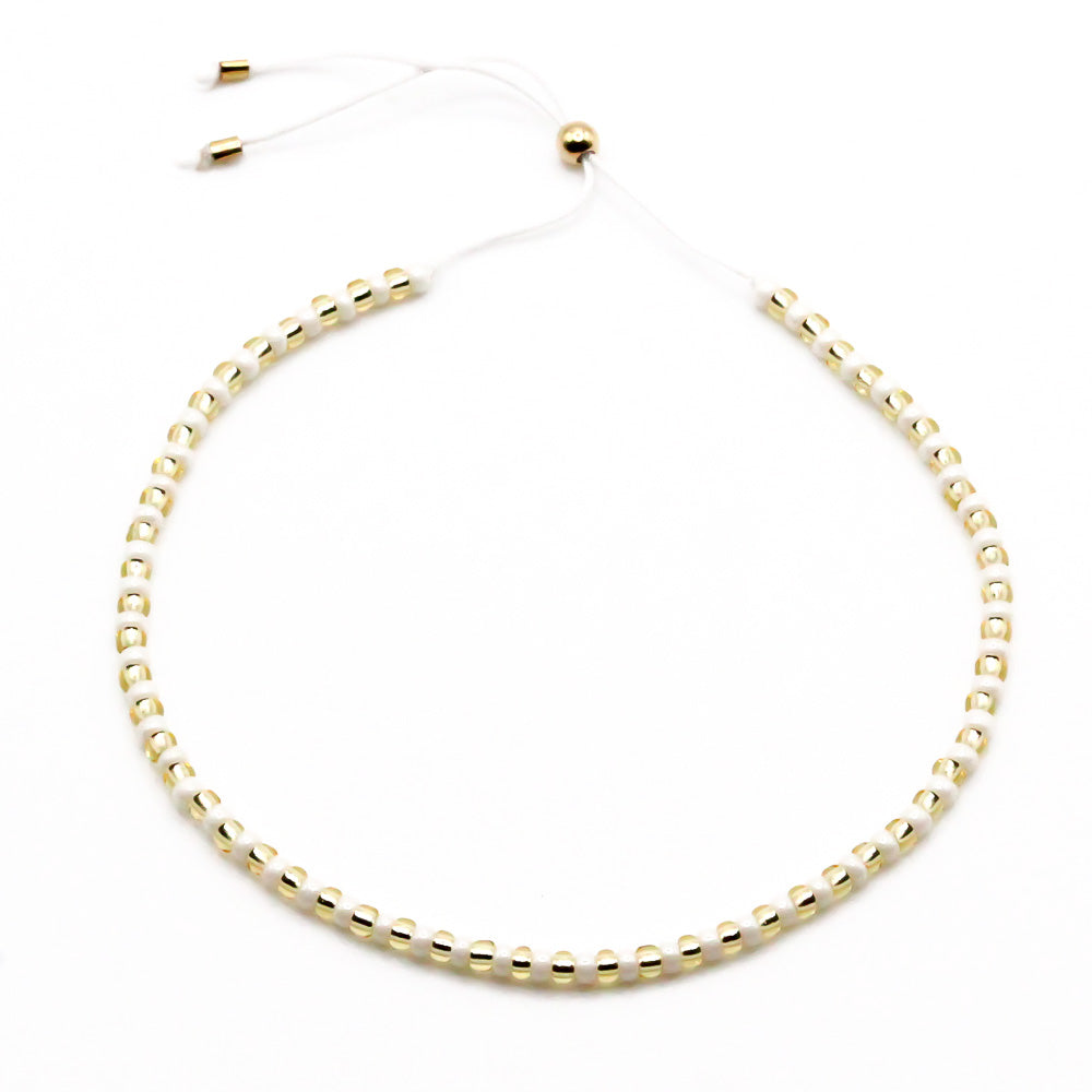 Sommerarmband cremeweiss und gold Perlen