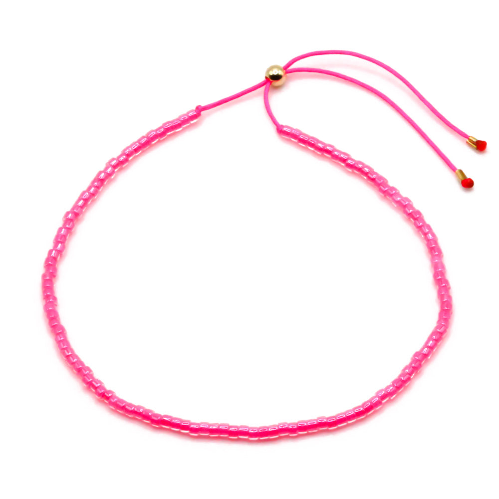 Handgemachtes pinkes Perlenarmband für Damen mit verstellbarem Kordelverschluss und goldenem Stopper. - Boho Perlenarmbänder Set Pink Wildflower - Lila, Pink