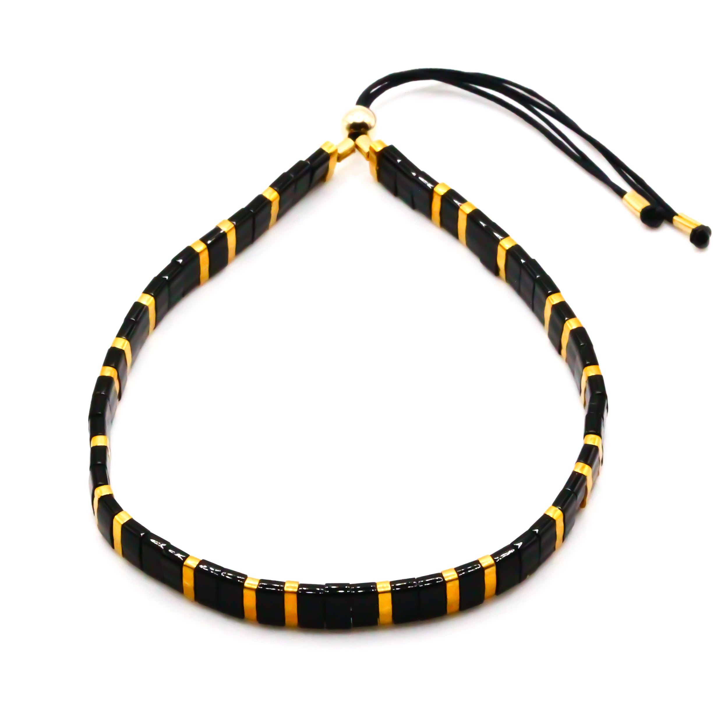 breites perlenarmband schwarz gold perlen