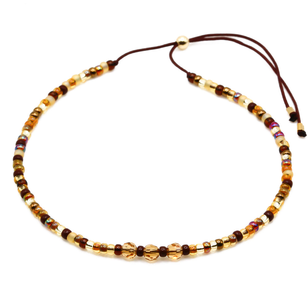 Perlenarmband braun mit Kristallen